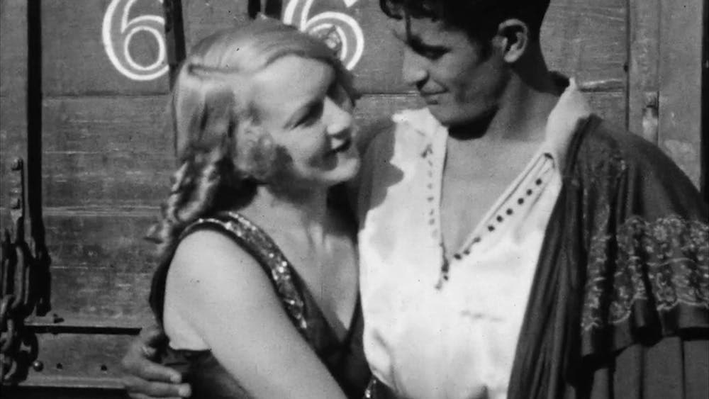 Black and white photo of a man and woman hugging looking at each other